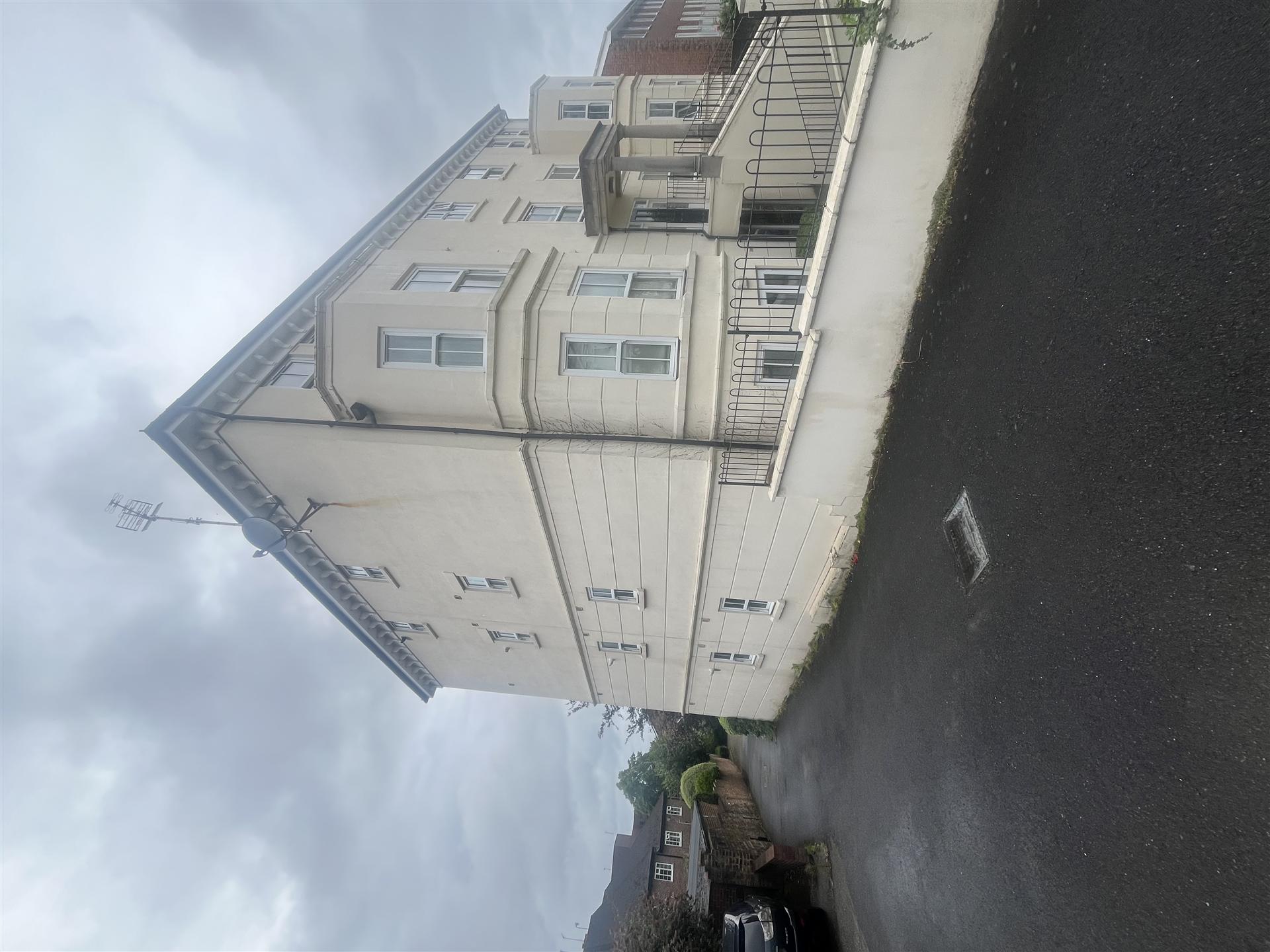 Large rendered apartment block exterior, Essex
